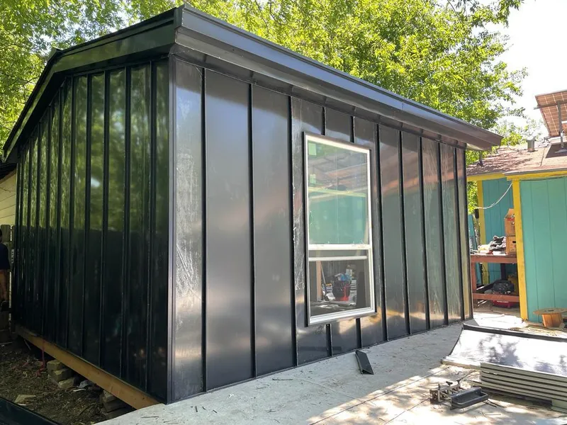 Black standing seam metal wall panels for Roof Inspection in Los Alamitos