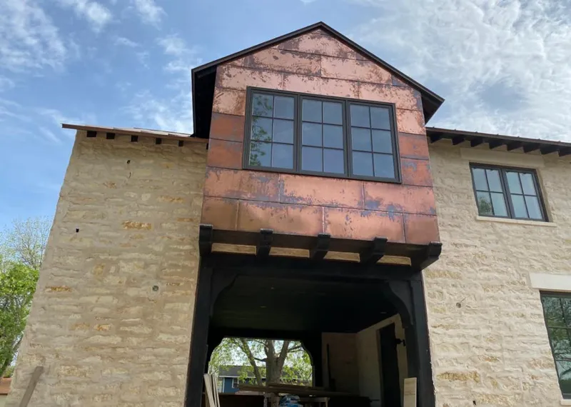 Copper metal panel facade on a stone building for Metal Roof Coating in Los Alamitos